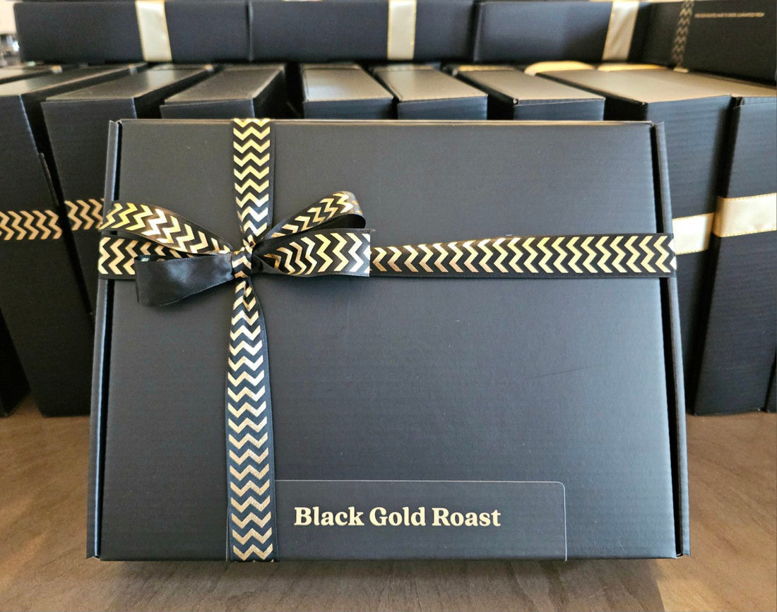 Custom coffee gift box by Black Gold Roast featuring five single-origin roasts with branded labels, created for a dental seminar by Alpine Periodontics.